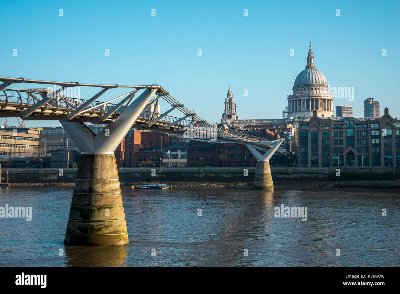 A view of London Millennium Bridge and St Paul's Cathedral from Bankside in South Bank of Thames River Stock Photo