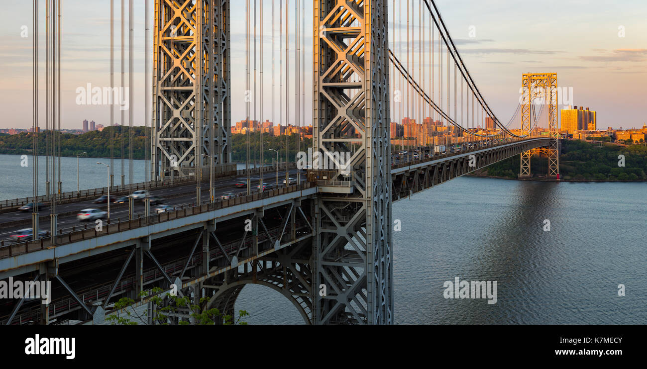 The George Washington Bridge at Sunset with view of Uptown and Fort Washington Park. New York City Stock Photo