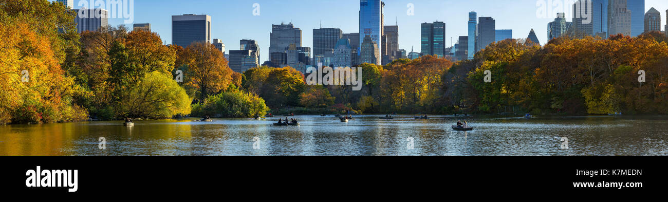 The Lake in Central Park in Fall with row boats in late afternoon. Manhattan, New York City Stock Photo