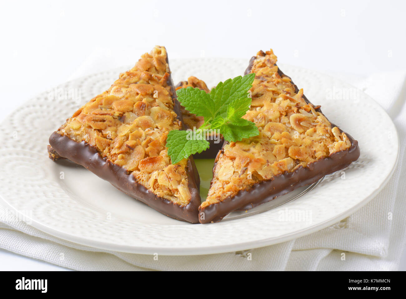 Triangle nut bars dipped in chocolate Stock Photo
