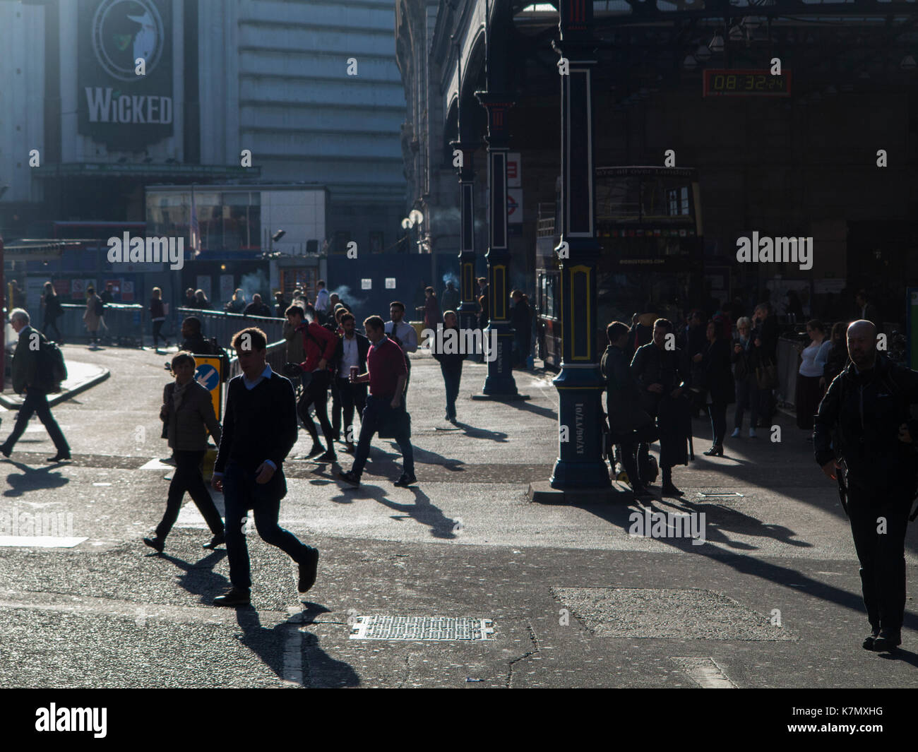 Early morning commuters at Victoria station terminus Stock Photo