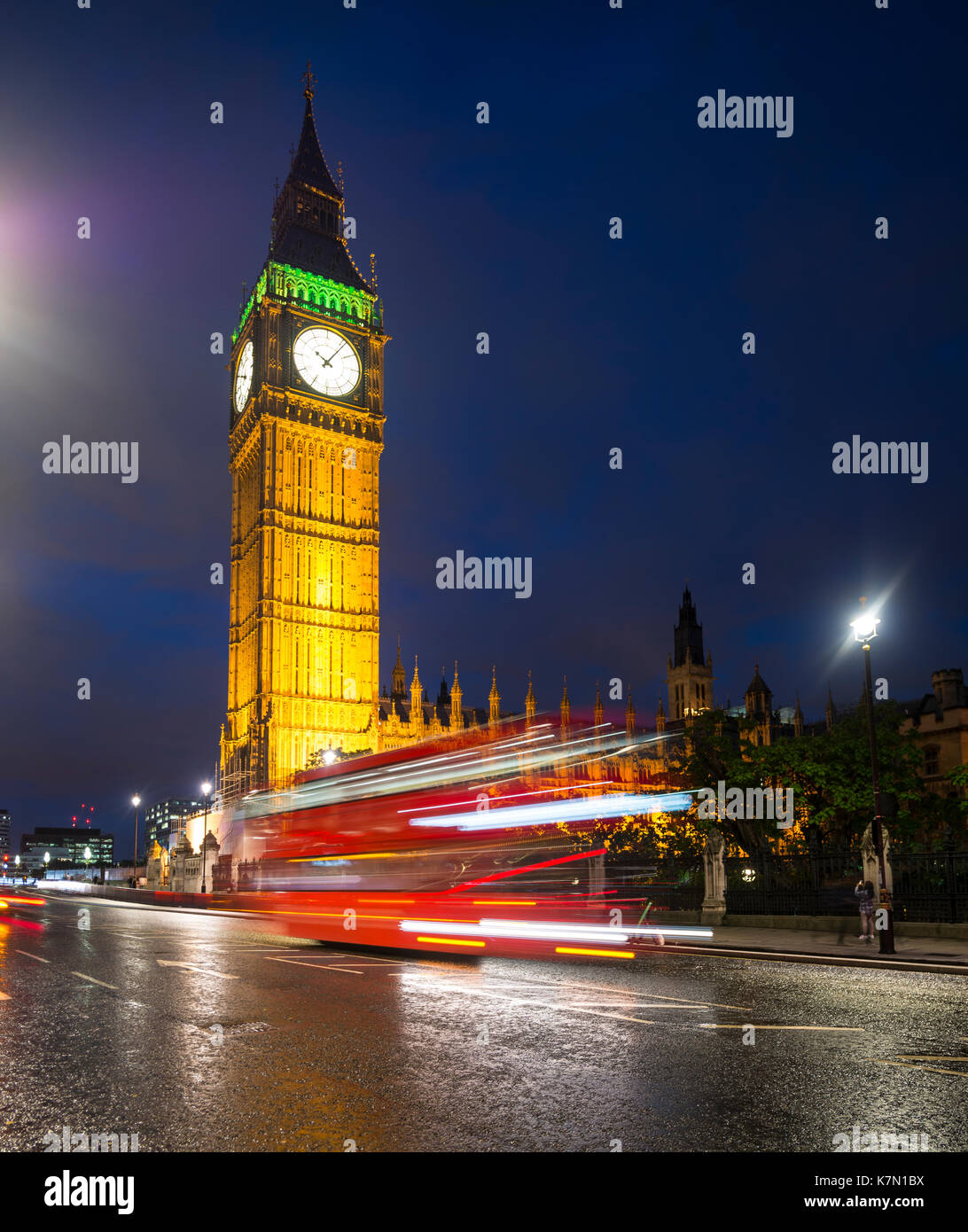 Red double-decker bus in front of Big Ben, Houses of Parliament, light tracks, night scene, City of Westminster, London Stock Photo