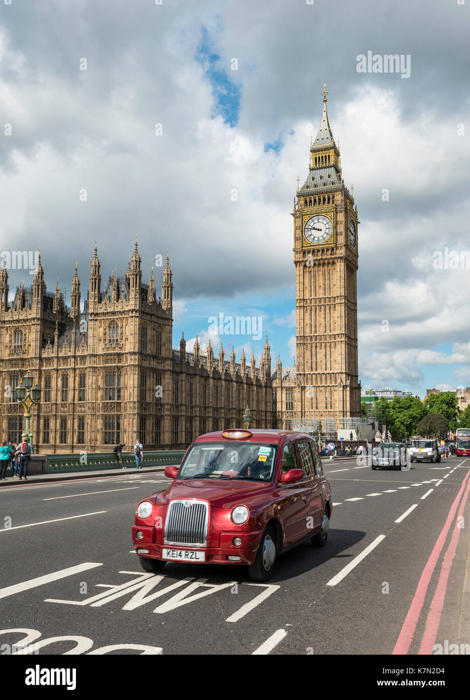 Red Taxi on the Westminster Bridge, Westminster Palace and Big Ben, London, England, Great Britain Stock Photo