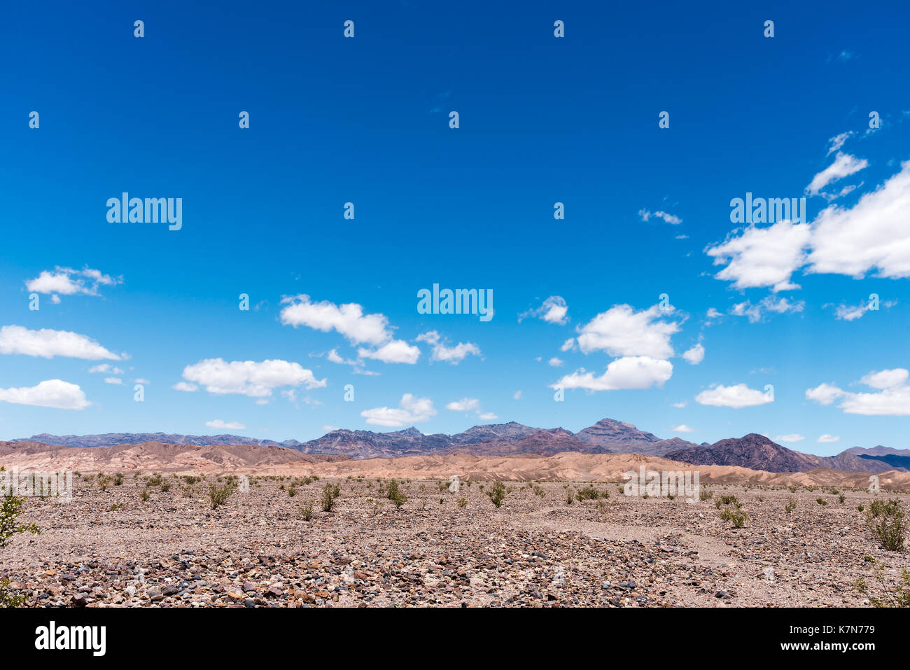 Desert Hills Under Blue Cloudy Sky Stock Photo - Alamy