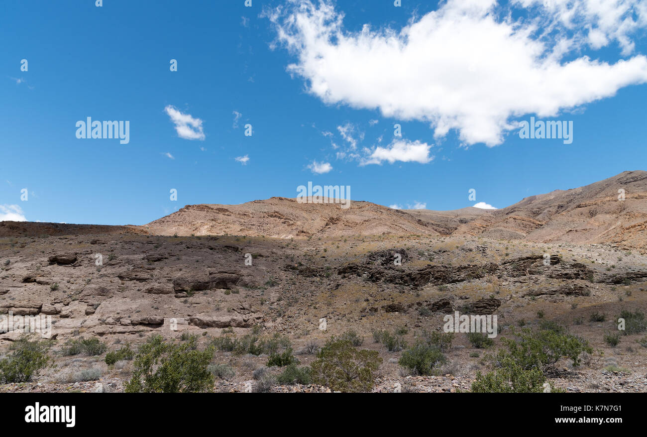 Desert rock mountain blue sky with clouds Stock Photo