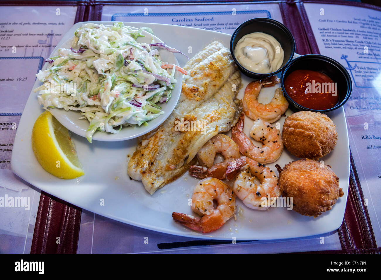 South Carolina,Mt. Pleasant,Shem Creek,waterfront,R.B.'s Seafood restaurant,dining,plate,shrimp,fish filet,hush puppies,coleslaw,SC170516040 Stock Photo