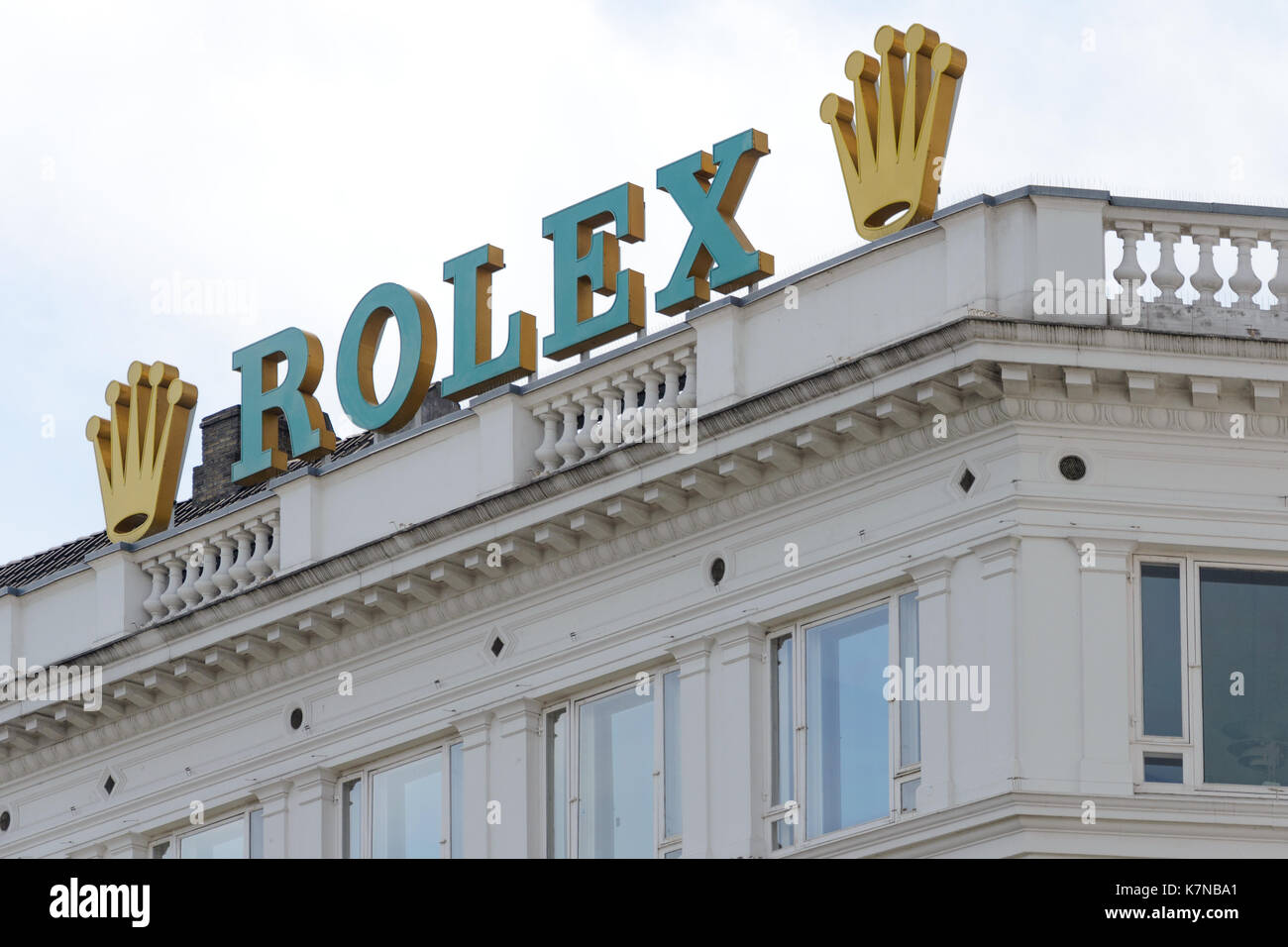 Copenhagen, Denmark - July 24, 2017: Rolex Company sign on the top of the building in Copenhagen. Rolex is a famous Swiss manufacturer of high-quality Stock Photo