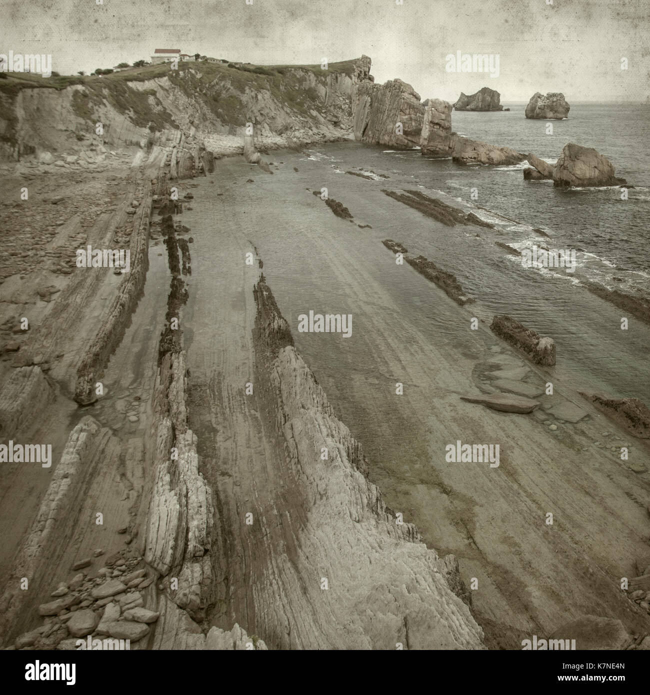 textured old paper background with Costa Quebrada, Cantabria Stock