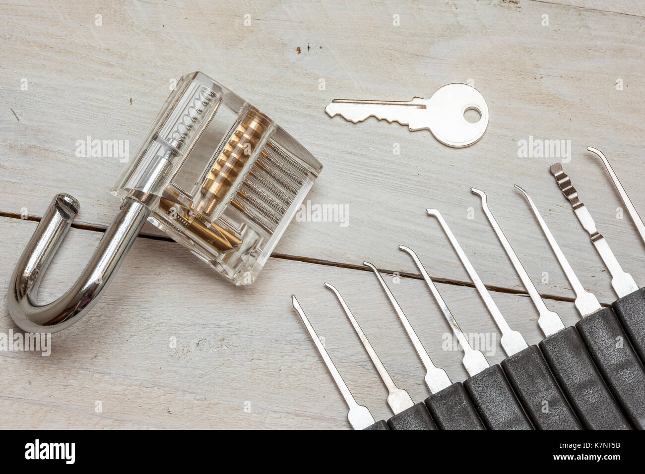 several lockpicking to open a lock on a door Stock Photo