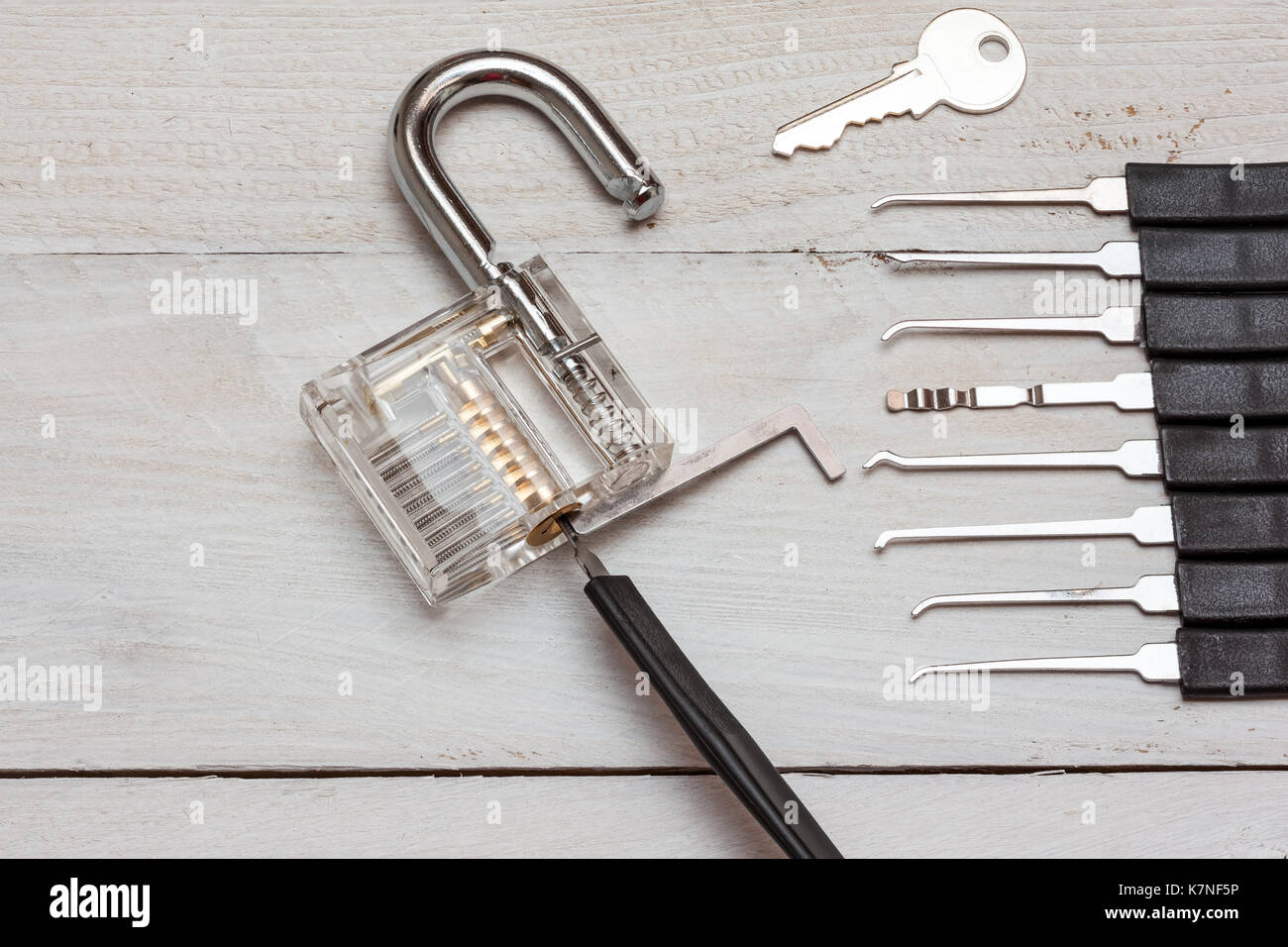 several lockpicking to open a lock on a door Stock Photo