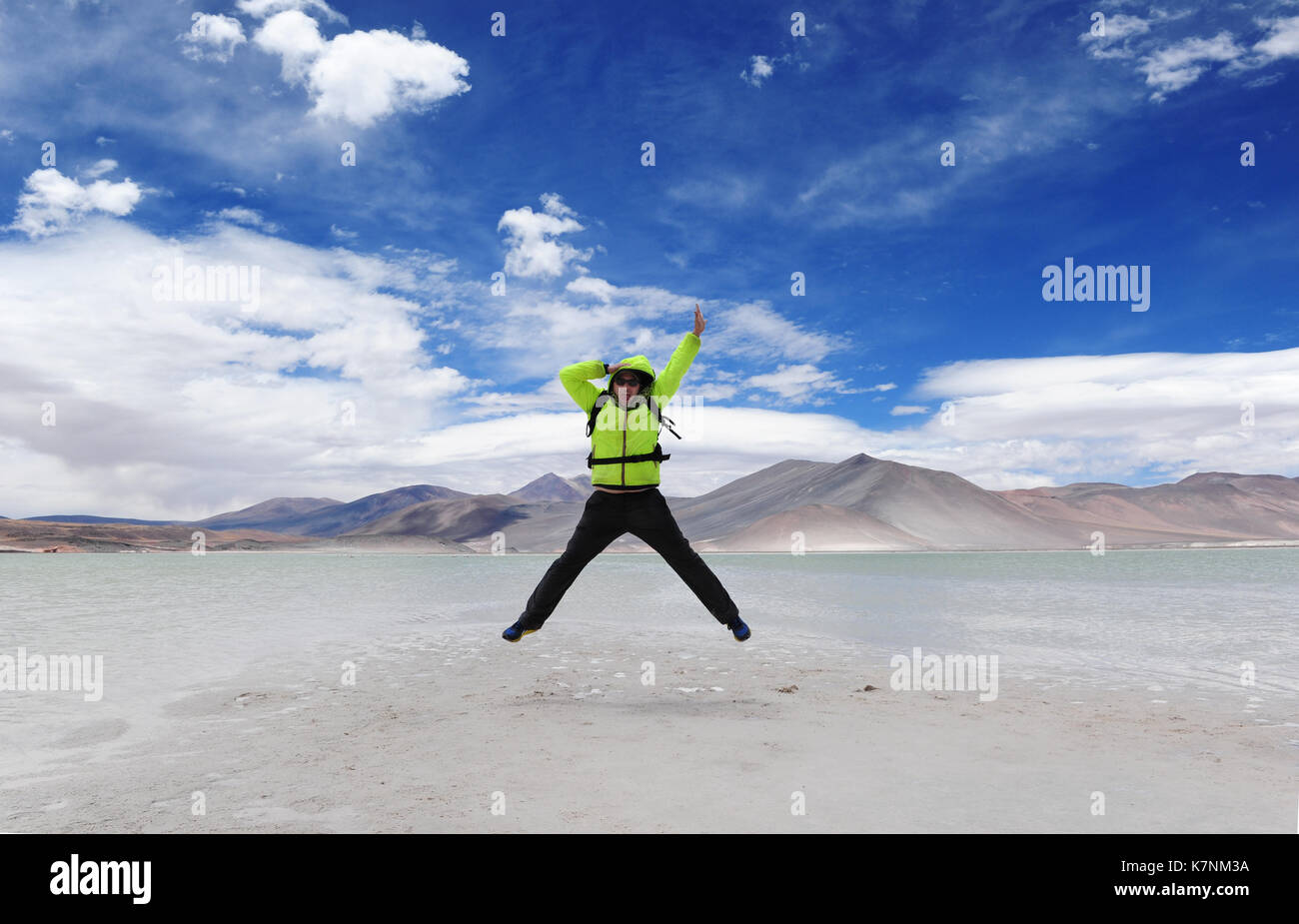 Young man jumping in the Salar de aguas calientes, aka as Salar de Talar, in the Atacama region, Northern Chile Stock Photo