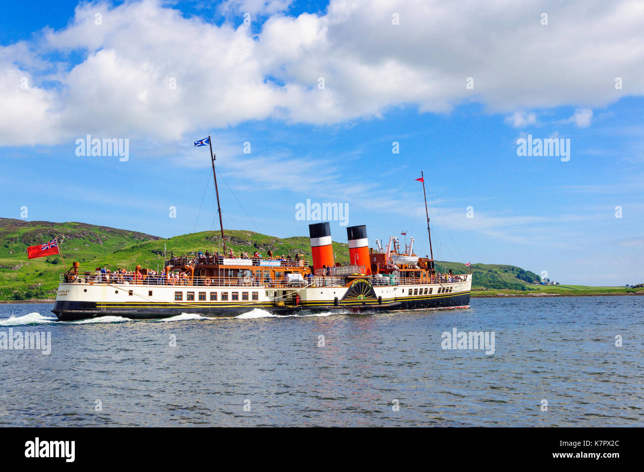 Tourists aboard the sea going paddle steamer Waverley on the Kyles of Bute near the village of
