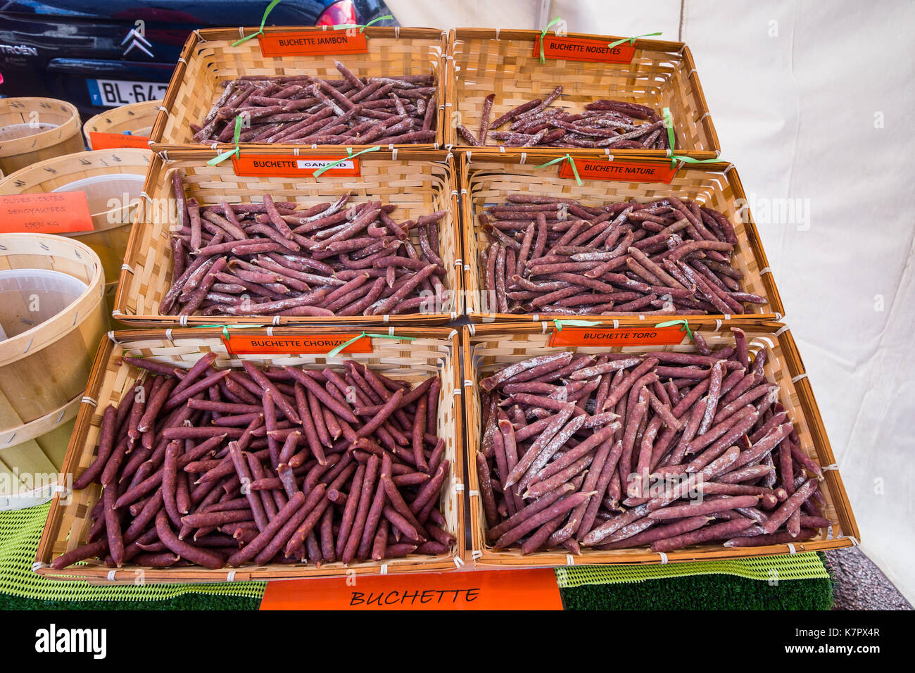 Buchettes ('sticks' of meats) for sale in street market - France. Stock Photo