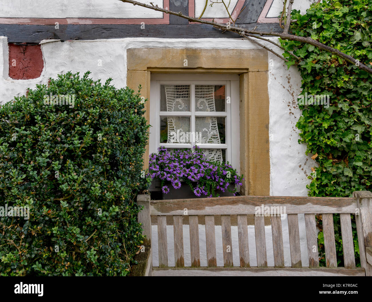 Romantic Bench In Front Of A Half Timbered House Window Stock