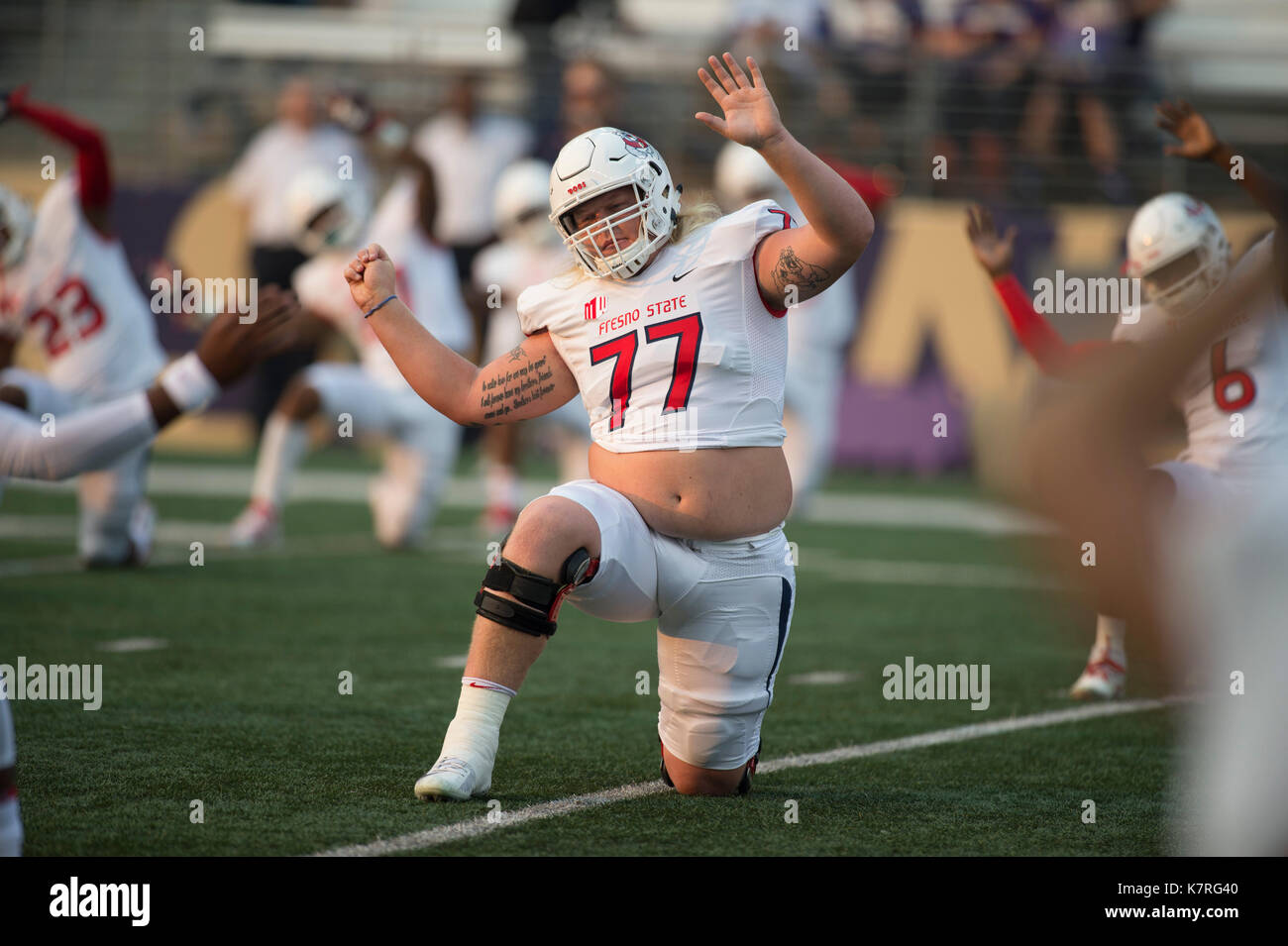 Seattle, WA, USA. 16th Sep, 2017. Fresno lineman Aaron Mitchell (77) stretches before a NCAA football game between the Fresno State Bulldogs and the Washington Huskies. The game was played at Husky Stadium in Seattle, WA. Jeff Halstead/CSM/Alamy Live News Stock Photo