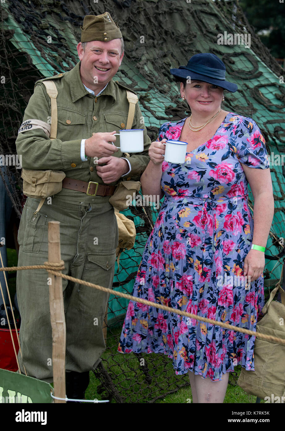 Chatham, Kent, UK. 17 September 2017.War time family Deborah Dean and Colin Taylor of Barming, Kent, are members of the Barmy Army Film Club, making Dad’s Army inspired films, today bringing the past to life with 1940s period dress and world war 2 era cars and planes at the Salute to the 40’s Vintage Weekend at Chatham Historic Dockyard. © Matthew Richardson/Alamy Live News Stock Photo