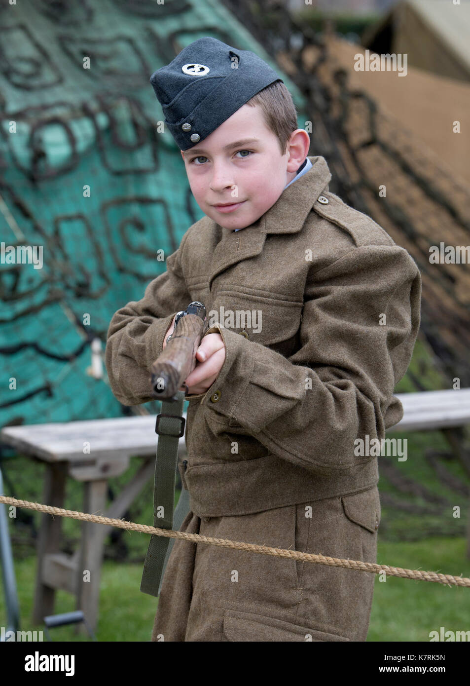 Chatham, Kent, UK. 17 September 2017. 10 year old War time family member Lance Taylor Dean stands guard, he is a members of the Barmy Army Film Club, making Dad’s Army inspired films, today bringing the past to life with 1940s period dress and world war 2 era cars and planes at the Salute to the 40’s Vintage Weekend at Chatham Historic Dockyard. © Matthew Richardson/Alamy Live News Stock Photo