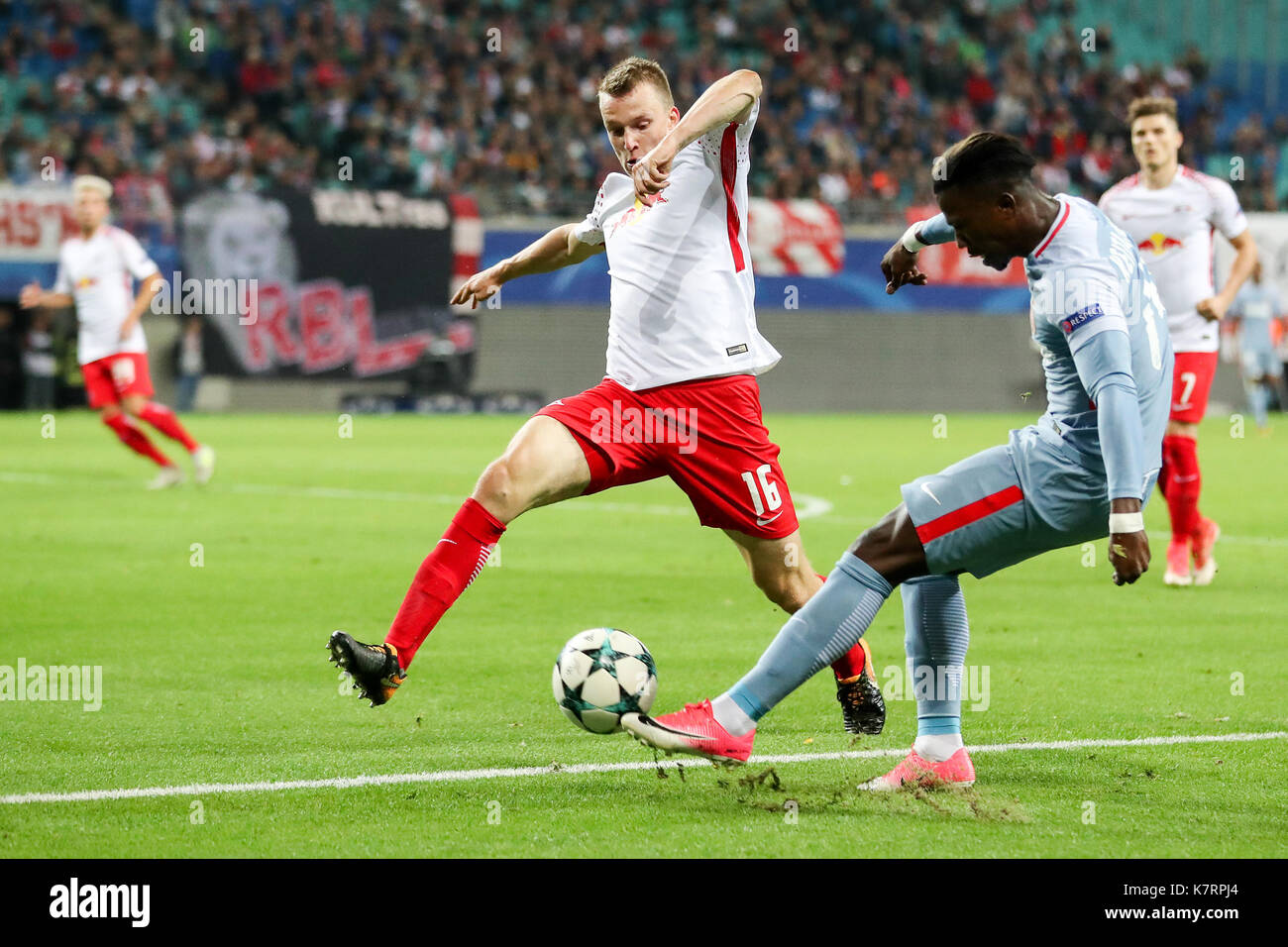 Leipzig, Germany. 13th Sep, 2017. Leipzig's Lukas Klostermann (L) and  Monaco's Djibril Sidibe vie for the ball during UEFA Champions League group  phase soccer match between RB Leipzig and AS Monaco FC