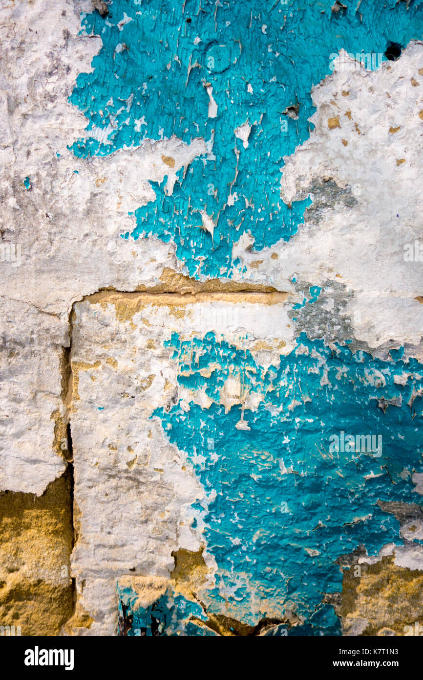Colorful peeling paint on a stone wall Stock Photo