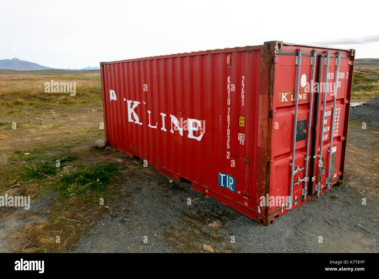 'K' line red container is left in the middle of nowhere. Stock Photo