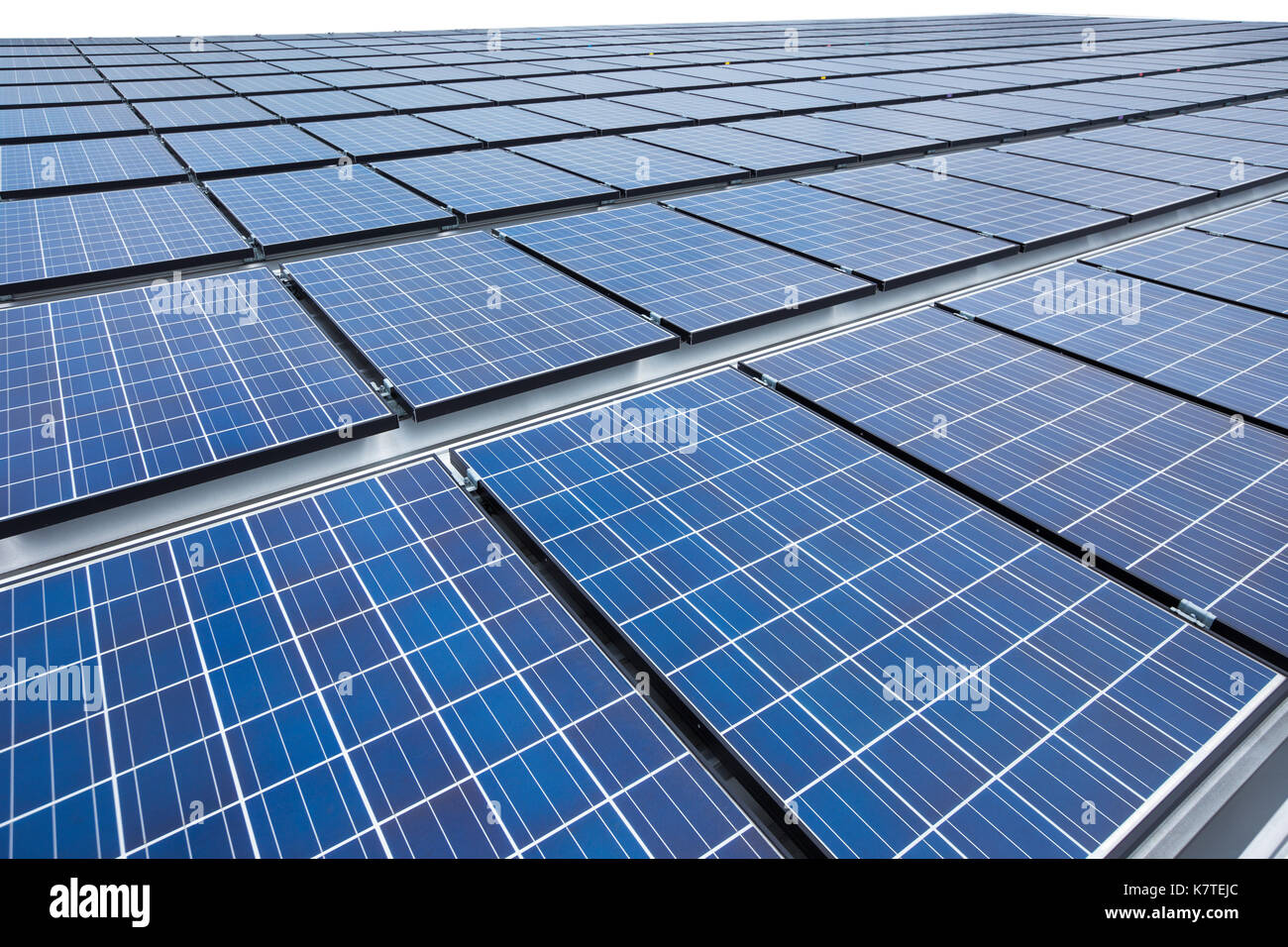 Solar panels on factory roof Stock Photo - Alamy