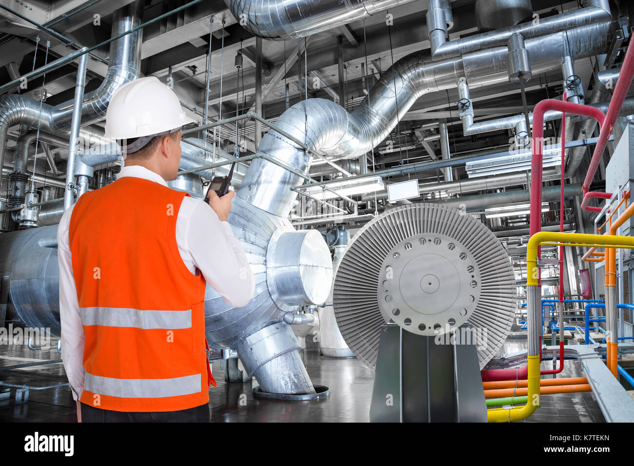 Maintenance engineer working in thermal power plant with talking on the