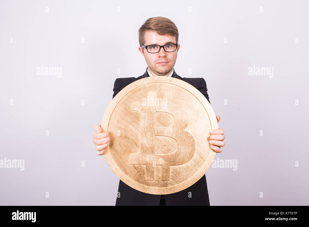 Business man holding big bitcoin in his hands. Cryptocurrency, people,  technology, money and future concept Stock Photo - Alamy