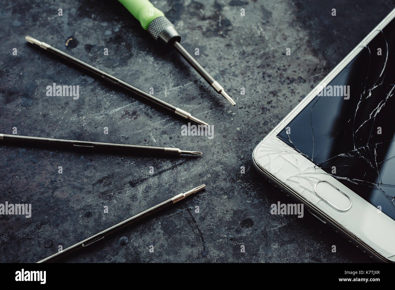 Picture of Smartphone with a broken screen and repair tools Stock Photo - Alamy