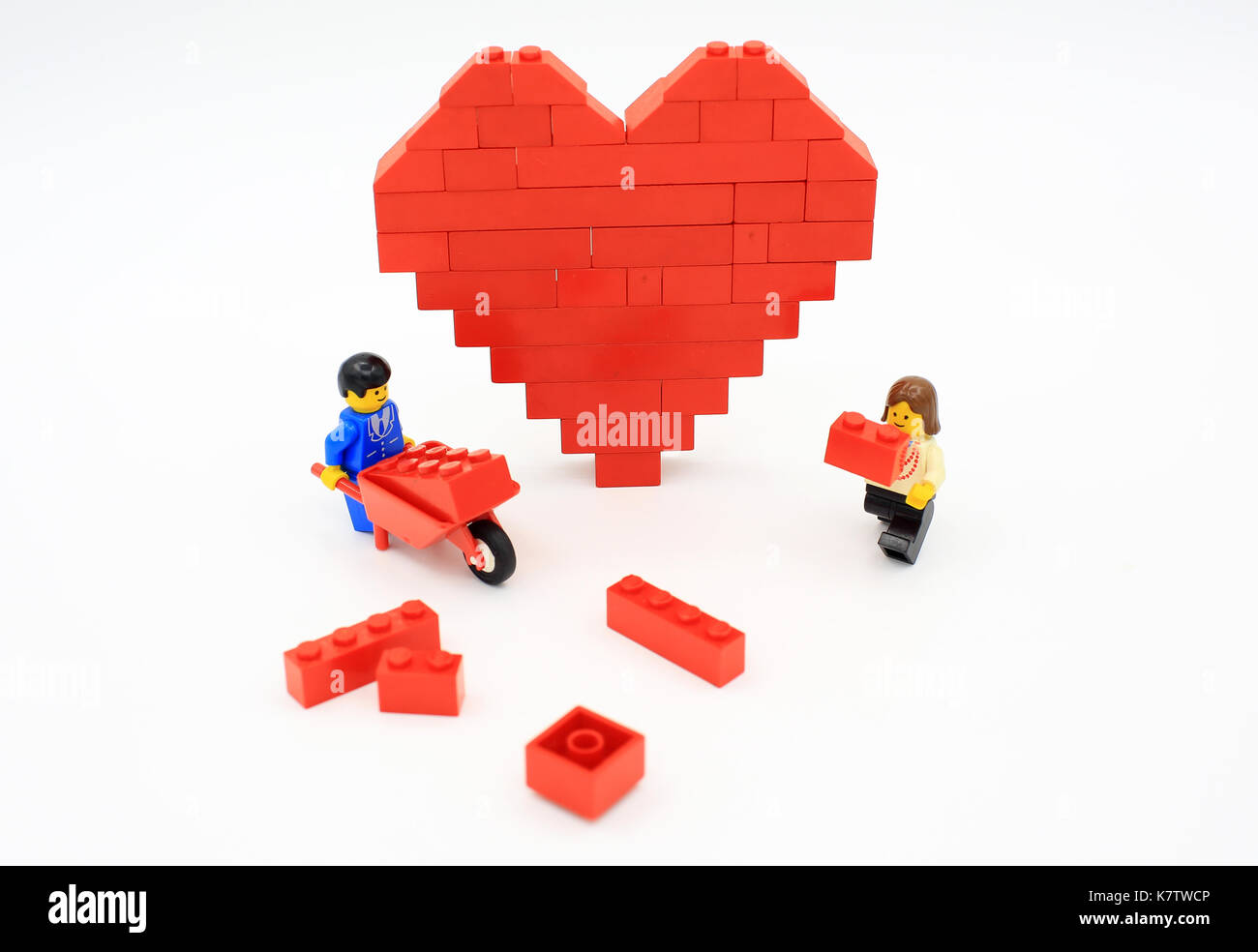 lego heart shaped love bricks which are isolated on white Stock