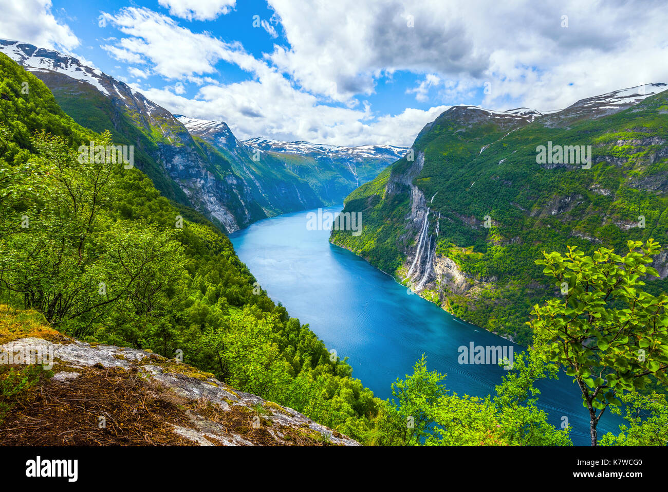 view from above to the Seven Sisters waterfall and the Geirangerfjorden with surrounding mountains, Norway Stock Photo
