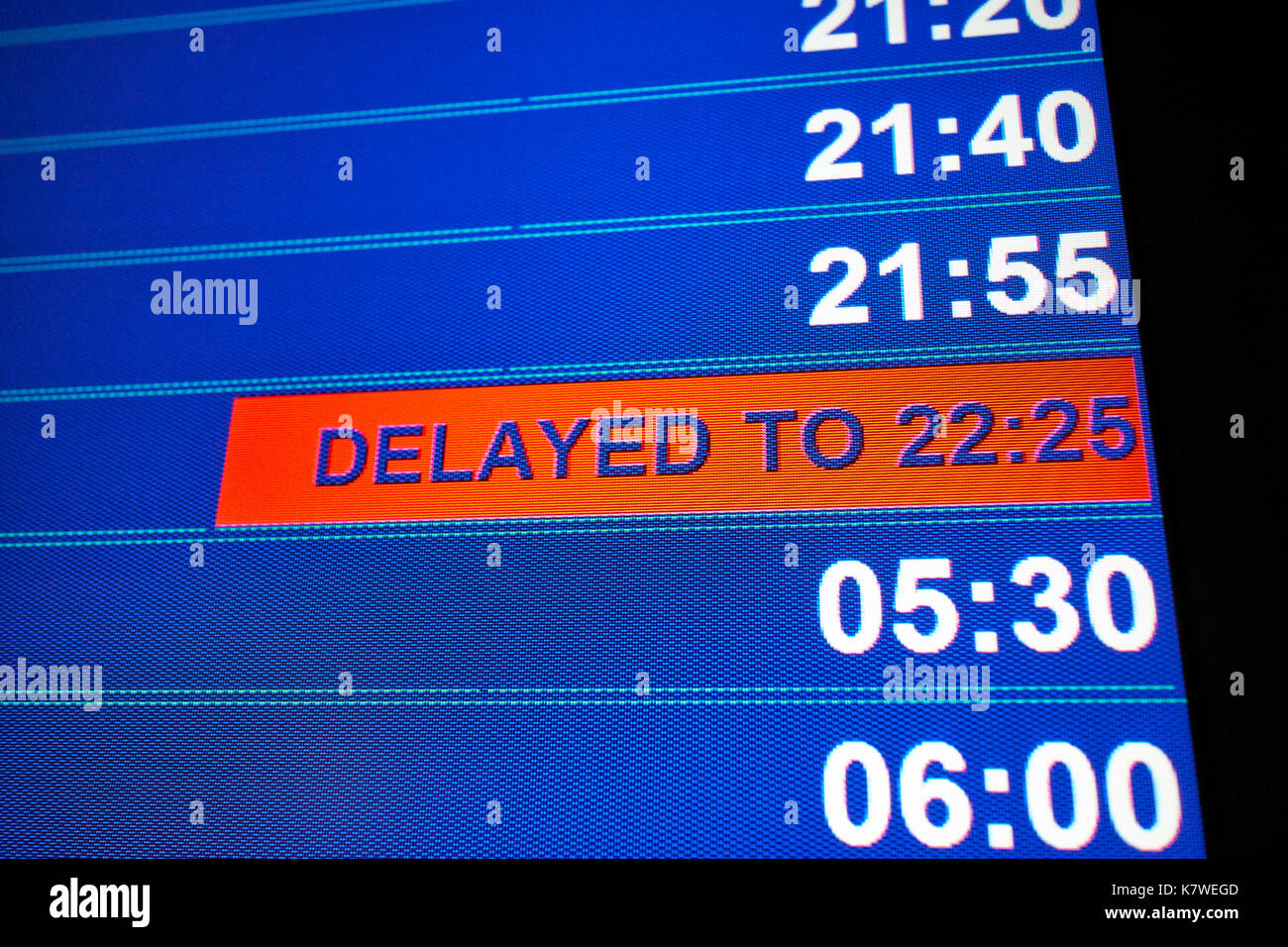 airport flight information screen showing delayed flight Stock Photo