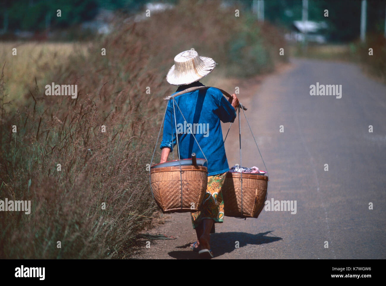 Woman carrying poles and baskets,Lampang,Thailand Stock Photo Alamy