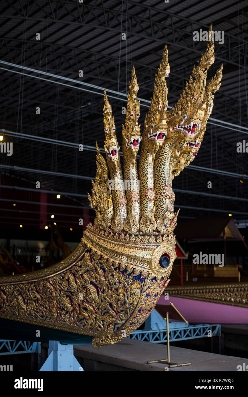 Royal Barge Anantanagaraf is a seven-headed nagas shape prow. Decorated with golden lacquer and glass ornaments. The hull is green outside and red ins Stock Photo