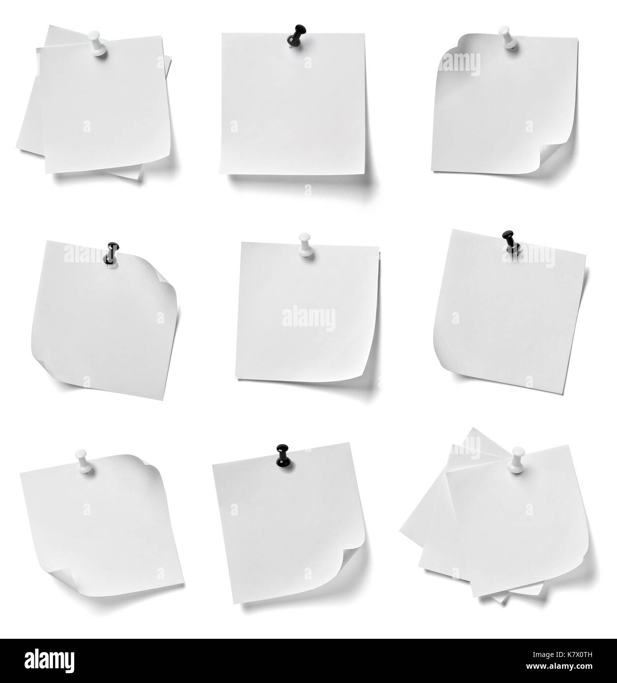 collection of various note paper with a red push pin on white ...