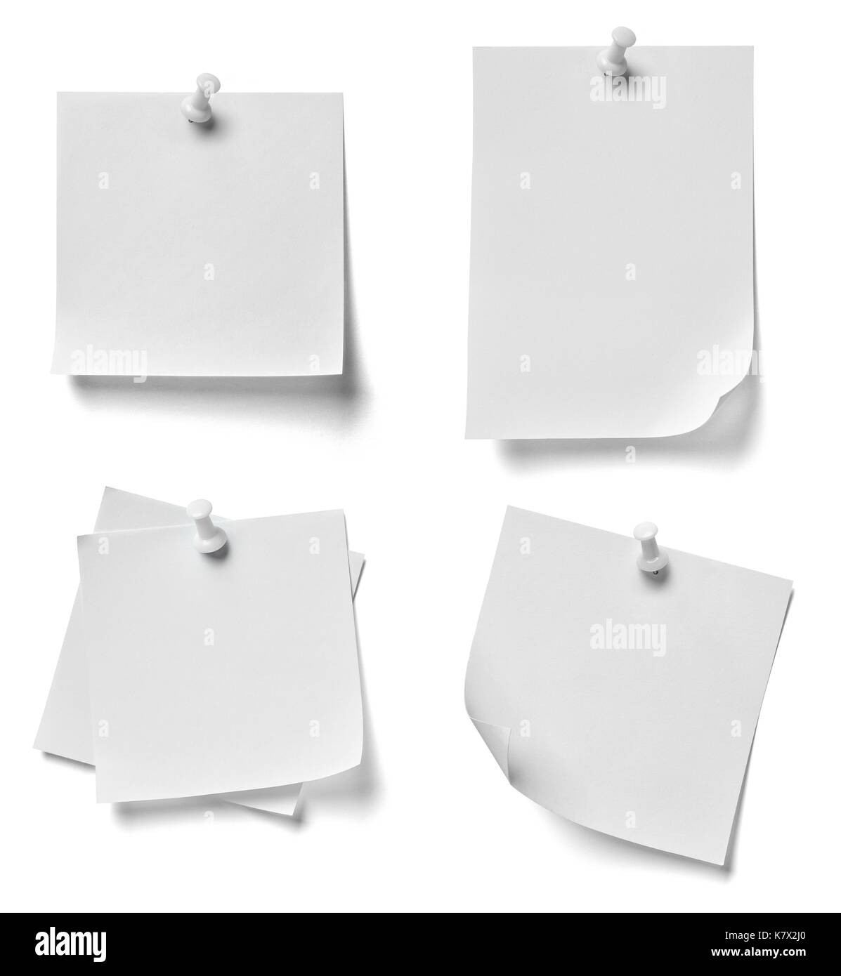 collection of various note paper with a red push pin on white ...