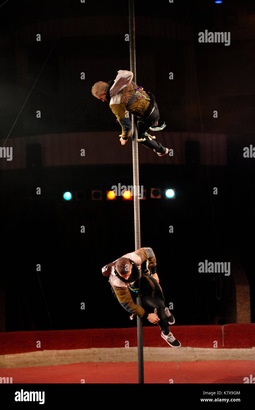 Rehearsal of the National Circus of Ukraine artists. Pole dance (chorde-de-pareil). Stock Photo