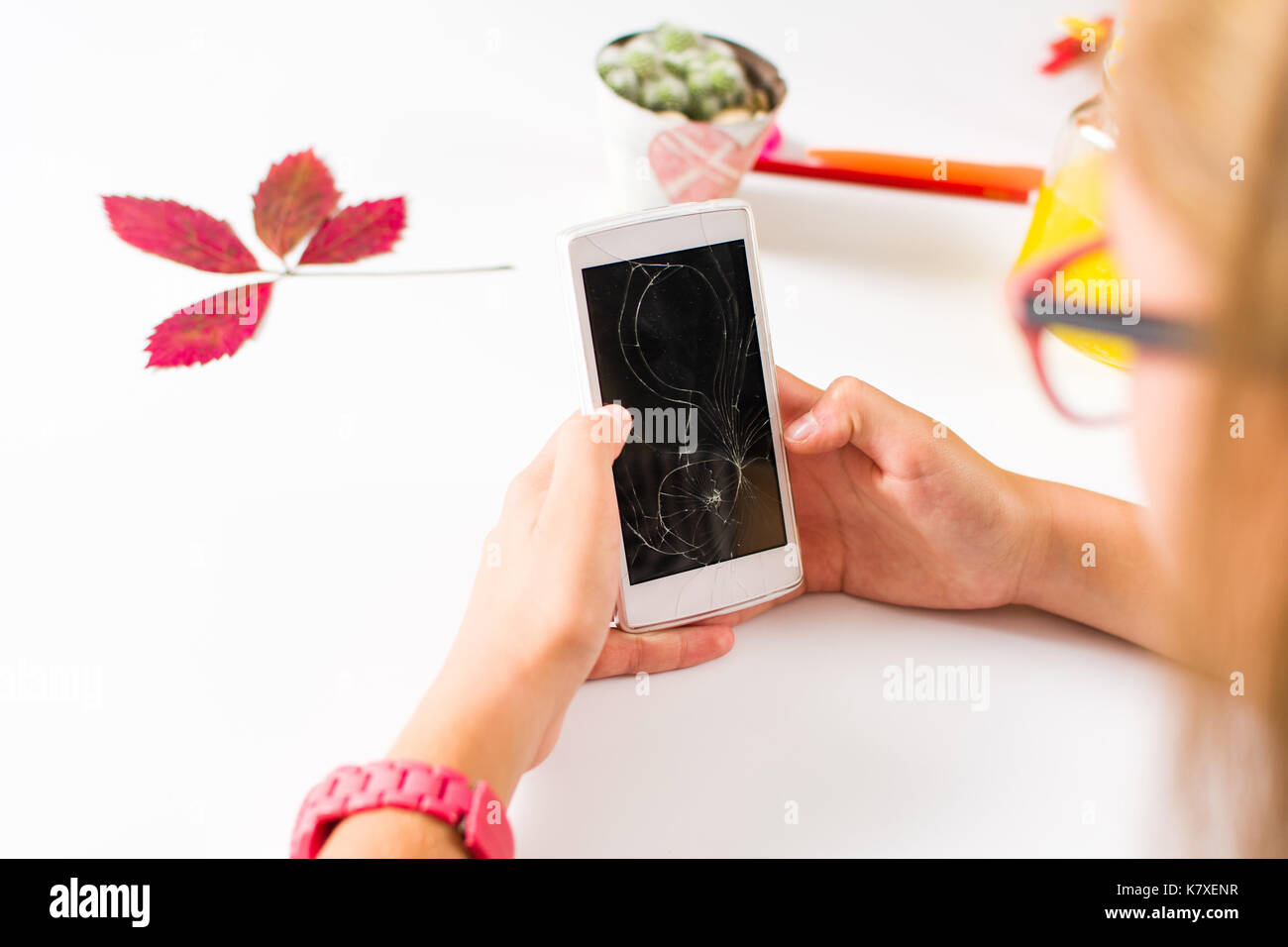 Girl Using A Phone With Broken Screen Stock Photo Alamy