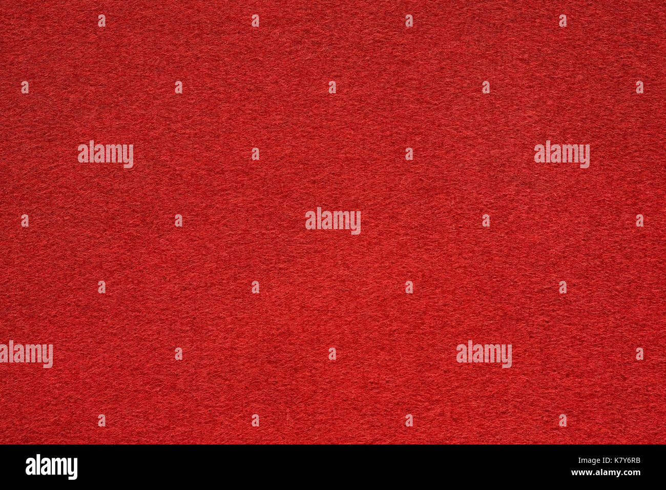 Red felt table surface extremal close up. Large macro texture and background Stock Photo
