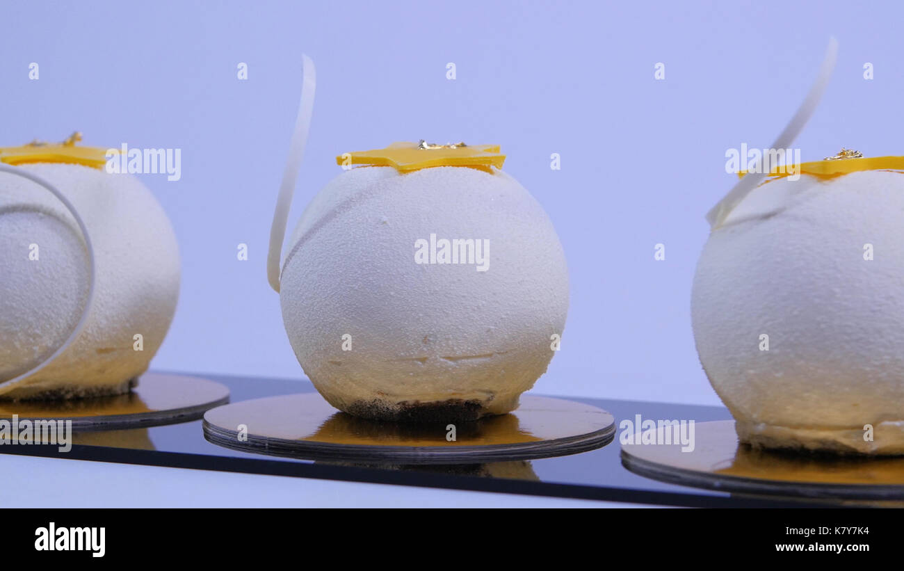 Velvet cake balls with sugar sprinkles. White, ballshaped cakes