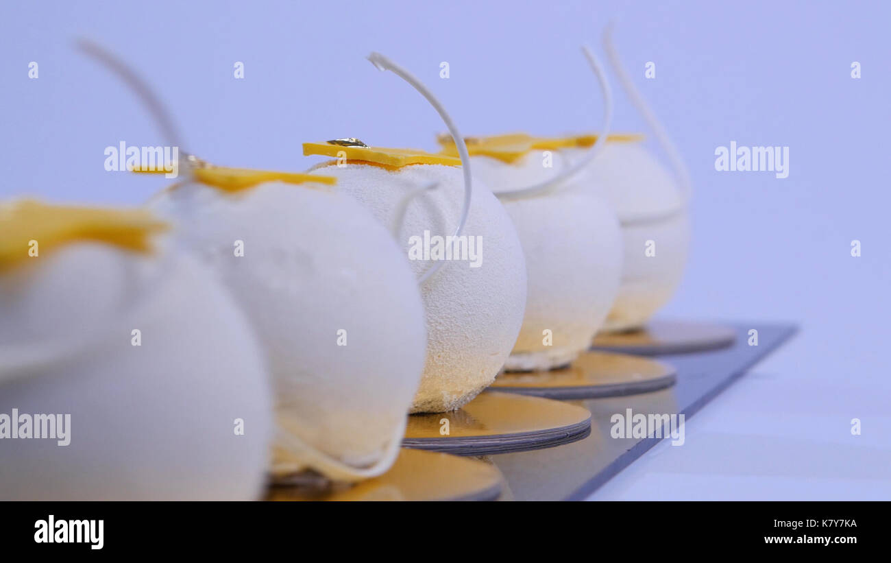 Velvet cake balls with sugar sprinkles. White, ballshaped cakes