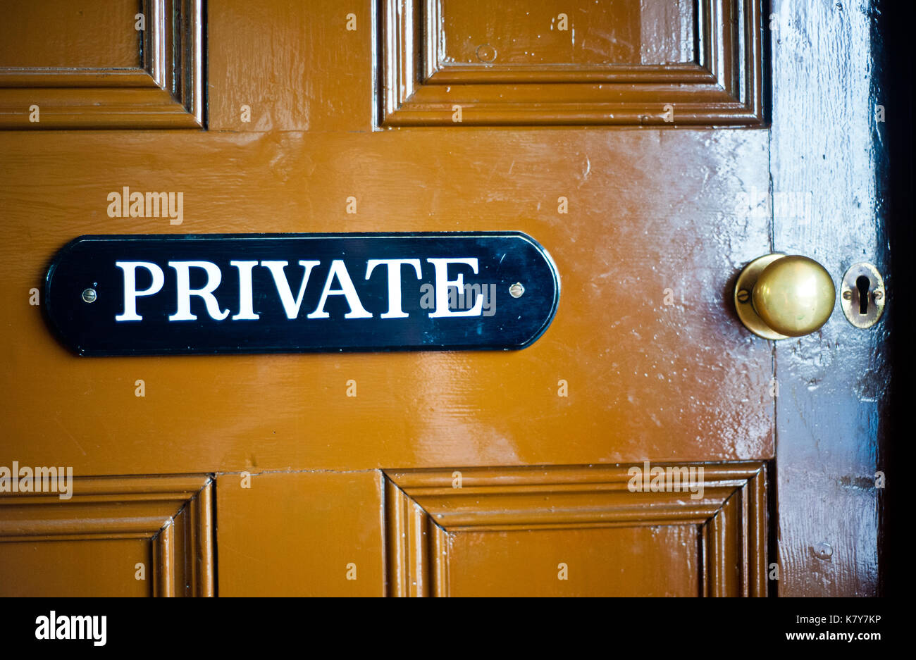 Privat sign on brown door Stock Photo