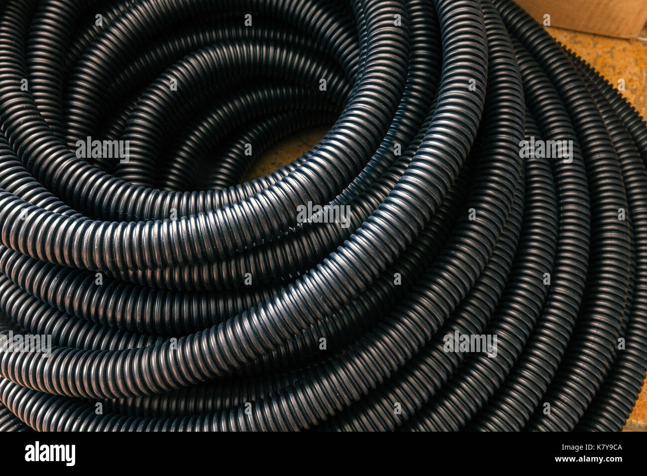 black ribbed plastic hose for electrical installations Stock Photo Alamy