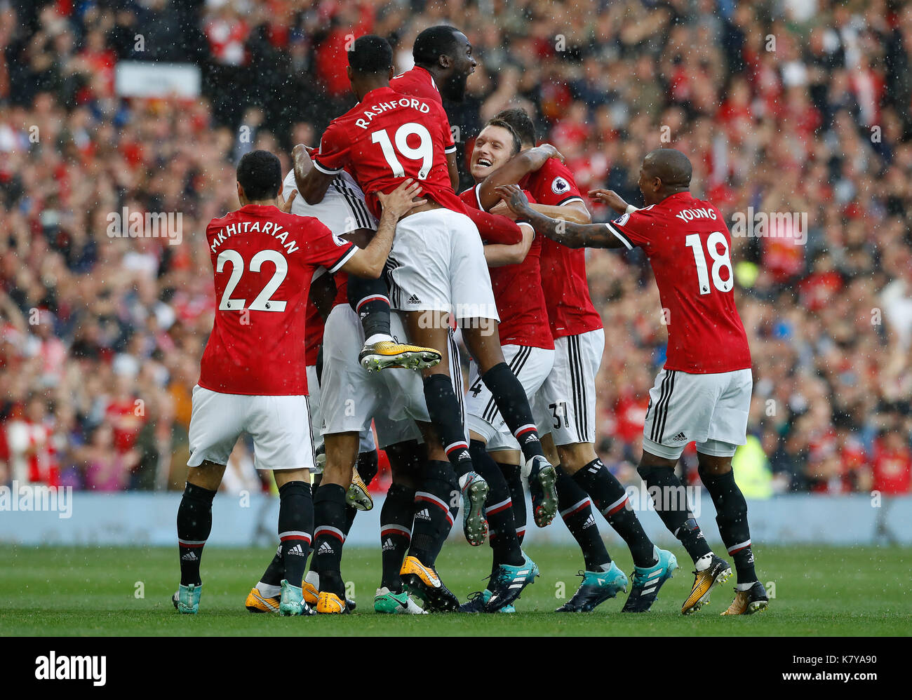 Manchester United Players Celebrate After Antonio Valencia Obscured Scores Their Side S First Goal During The Premier League Match At Old Trafford Manchester Stock Photo Alamy