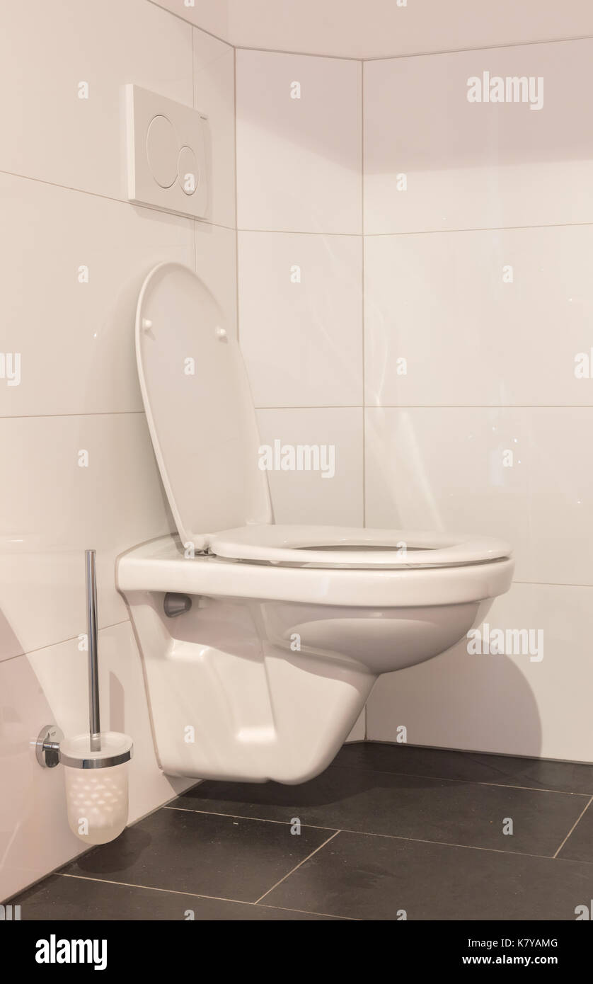 Modern white toilet bowl in the bathroom Stock Photo - Alamy