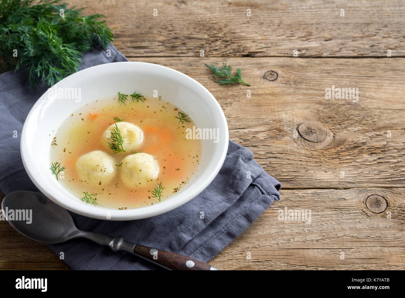Matzoh ball soup. Jewish traditional cuisine, homemade Matzo Ball soup with vegetables. Stock Photo
