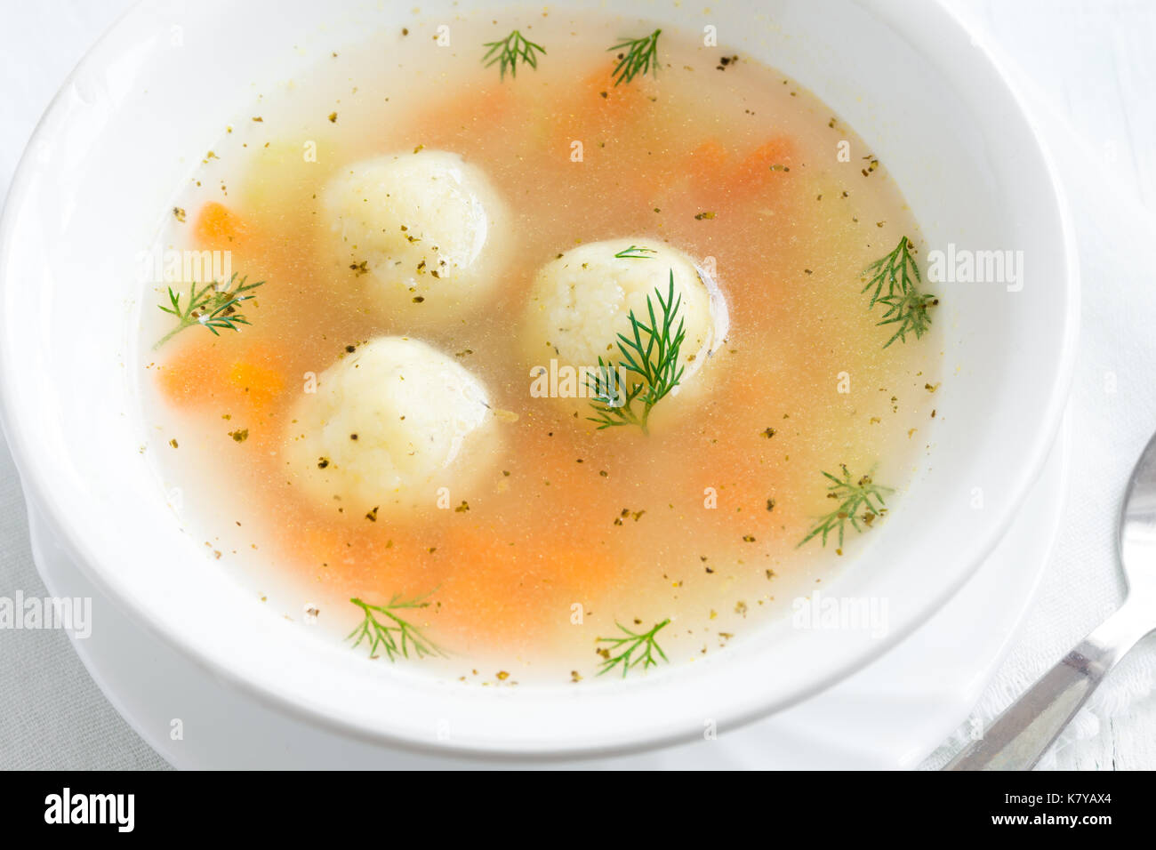 Matzoh ball soup. Jewish traditional cuisine, homemade Matzo Ball soup with vegetables. Stock Photo