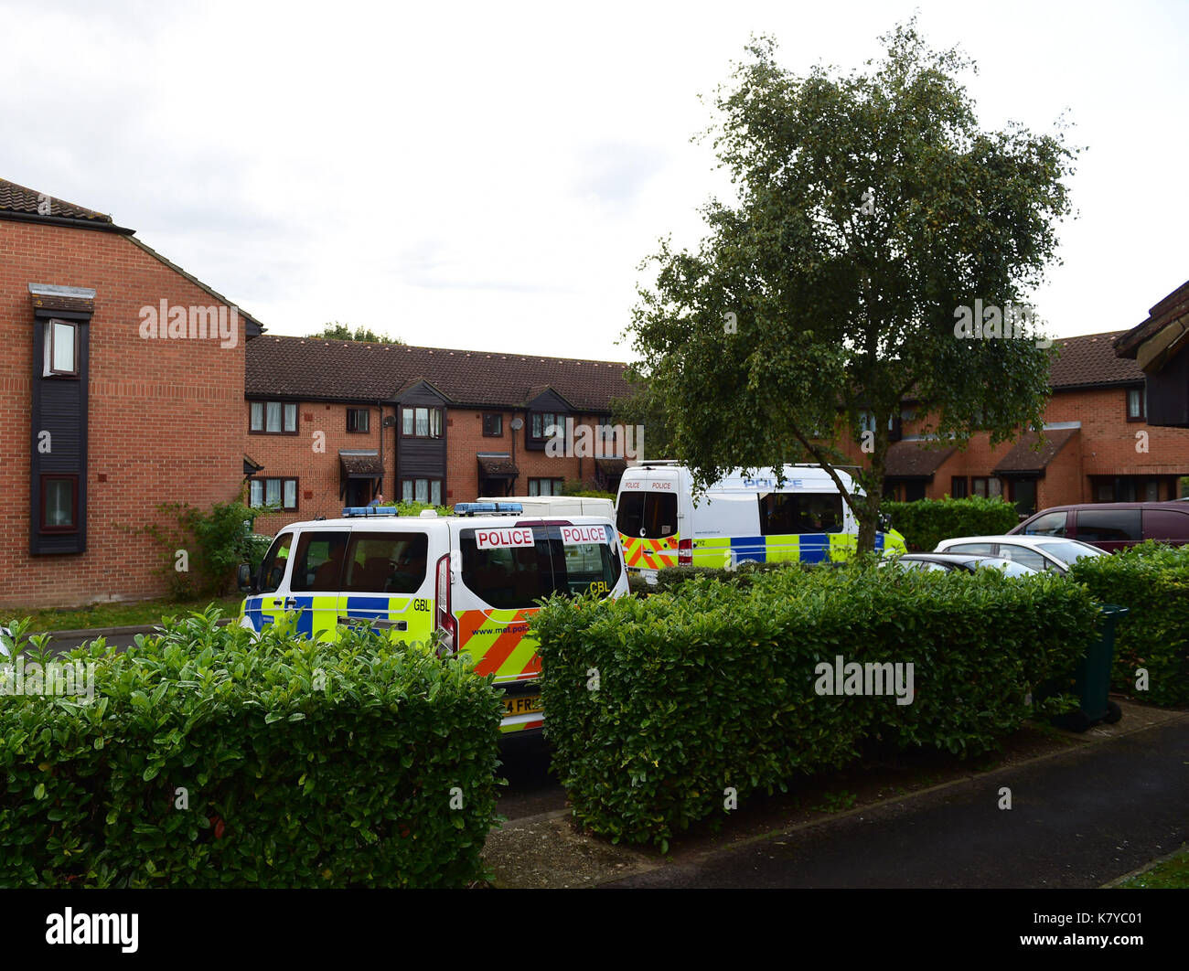 Police vehicles at a property in Stanwell, Surrey, which is being searched by officers investigating the Parsons Green bombing. Stock Photo