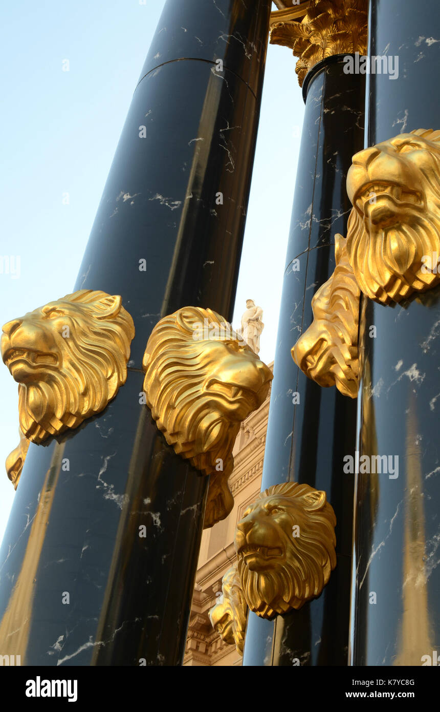 gold lion head sculpture black marble pillars Stock Photo Alamy
