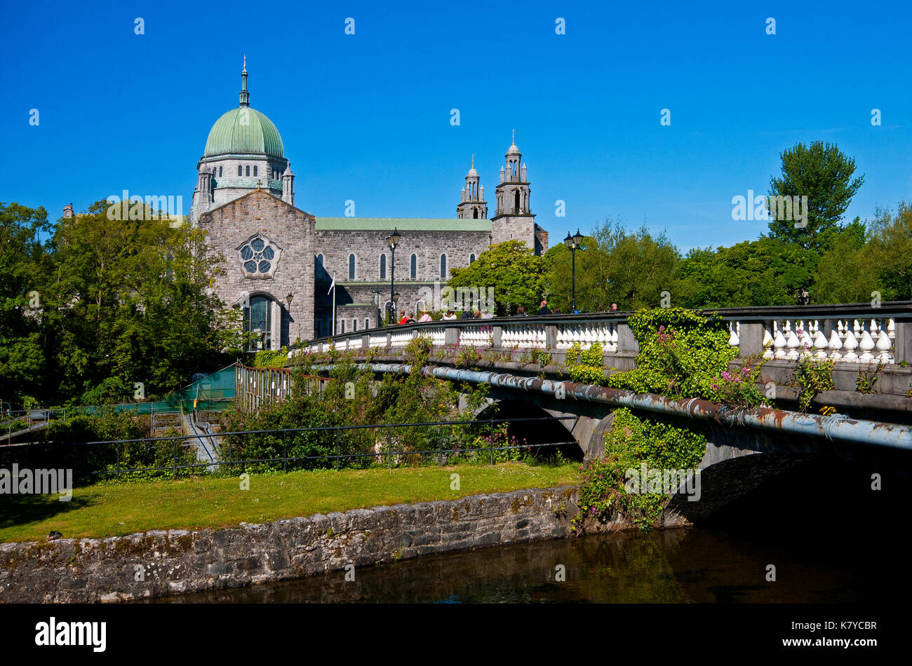 Galway Cathedral and Salmon Weir Bridge on Corrib river, Galway, County