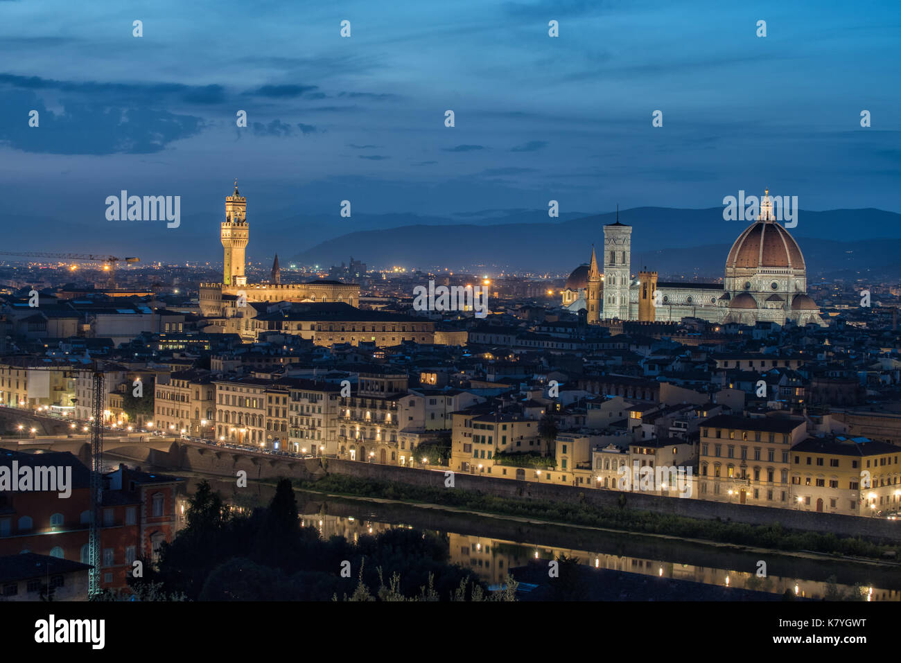 Aerial view of river Arno and Florence by night from Piazzale Michelangelo. Florence is one of the major tourist destinations in Italy. Stock Photo